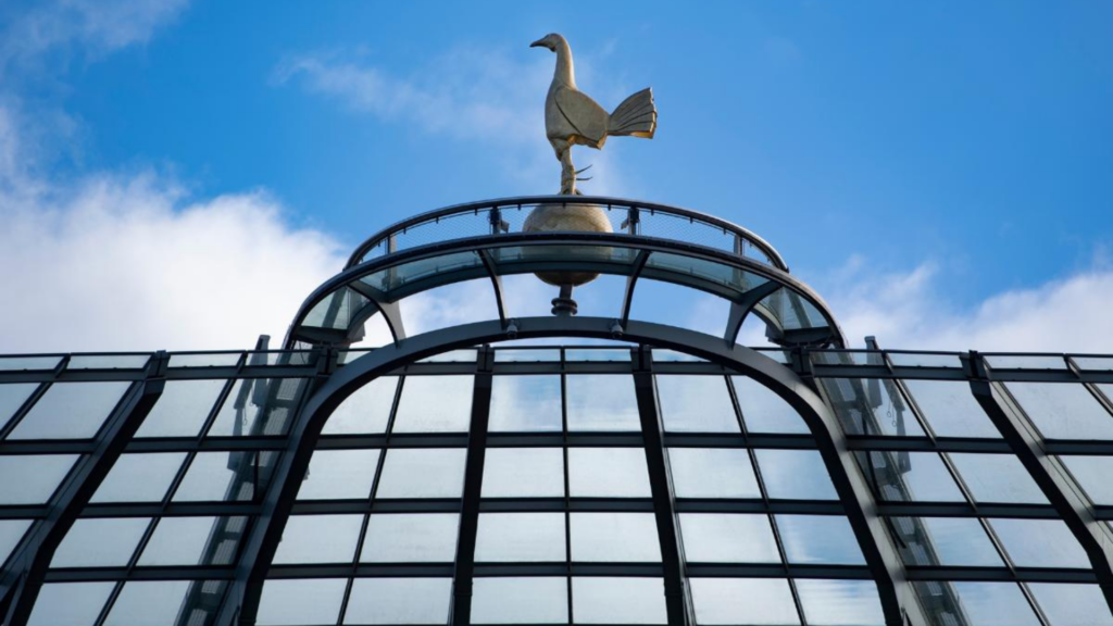Tottenham Hotspur Stadium in front of blue skies