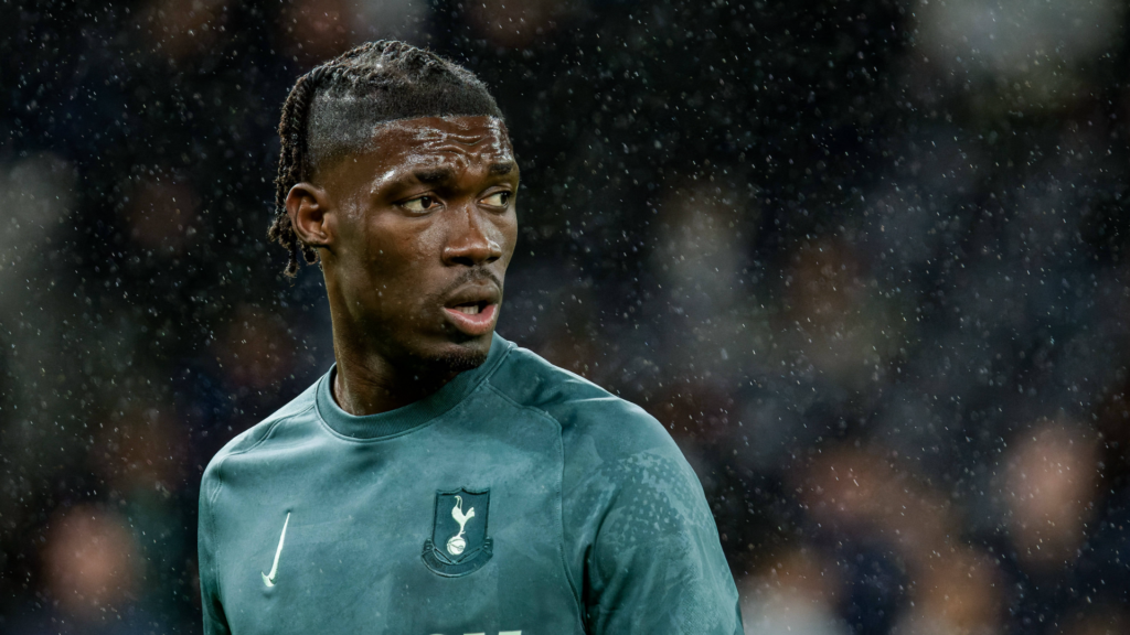 Tottenham midfielder Yves Bissouma stares to his right during a warmup before a game.