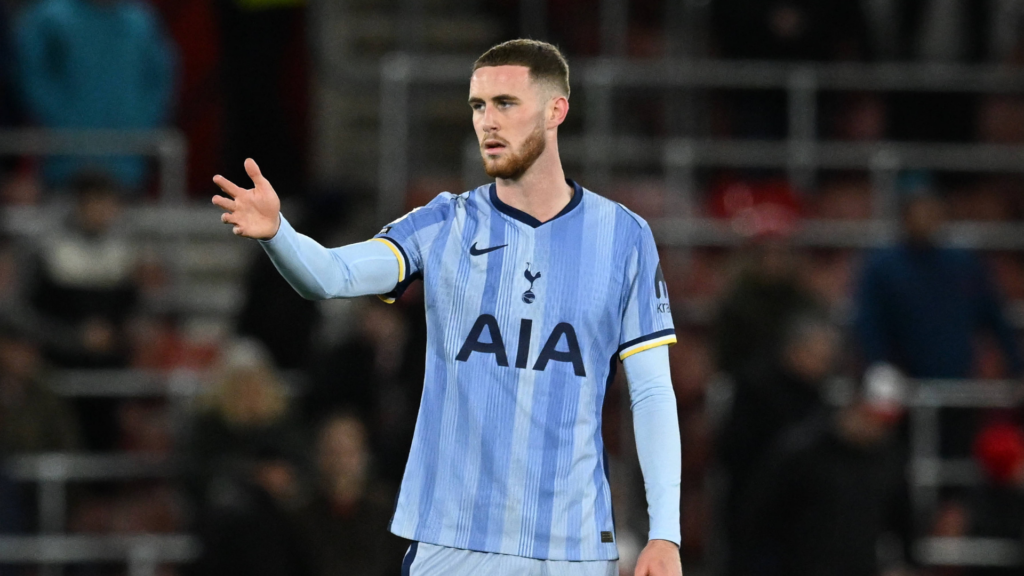 Tottenham defender Alfie Dorrington gesticulates with his arm out during a game.