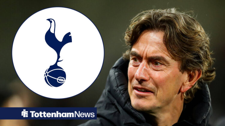 Tottenham manager Thomas Frank stares at the Spurs badge with a bemused facial expression.