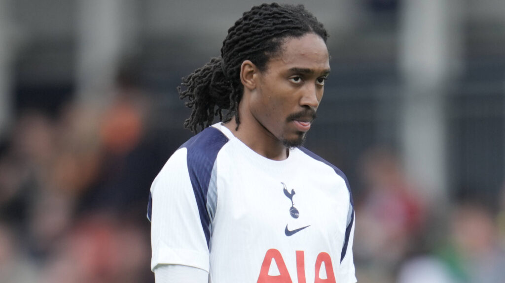 Tottenham ace Djed Spence in Tottenham's home strip