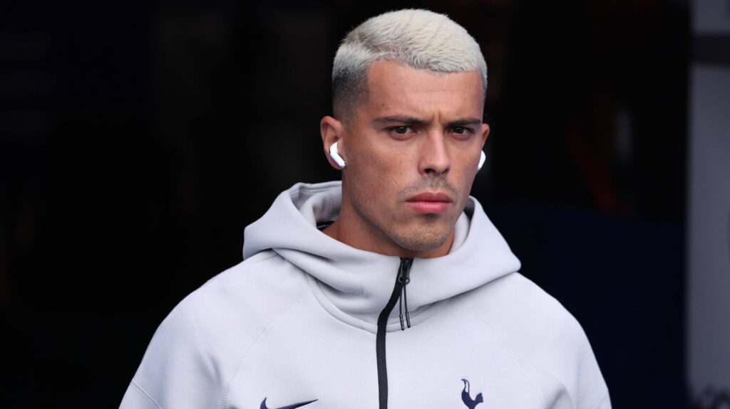 Tottenham defender Pedro Porro arrives at a game with his headphones in.