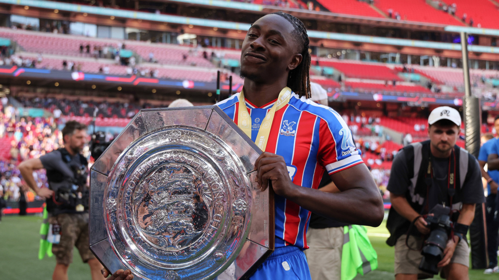 Tottenham target Eberechi Eze celebrates with the Community Shield trophy.