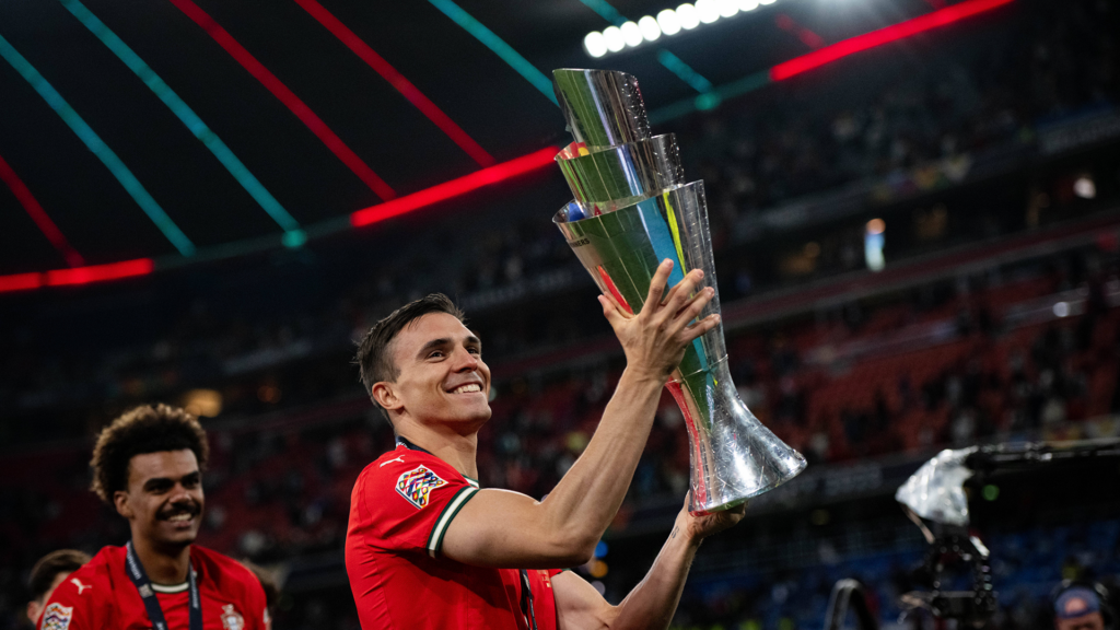 Tottenham-linked midfielder Joao Palhinha lifts the Nations League trophy.