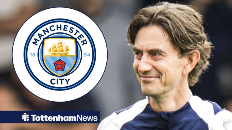 Thomas Frank smiling with Man City badge