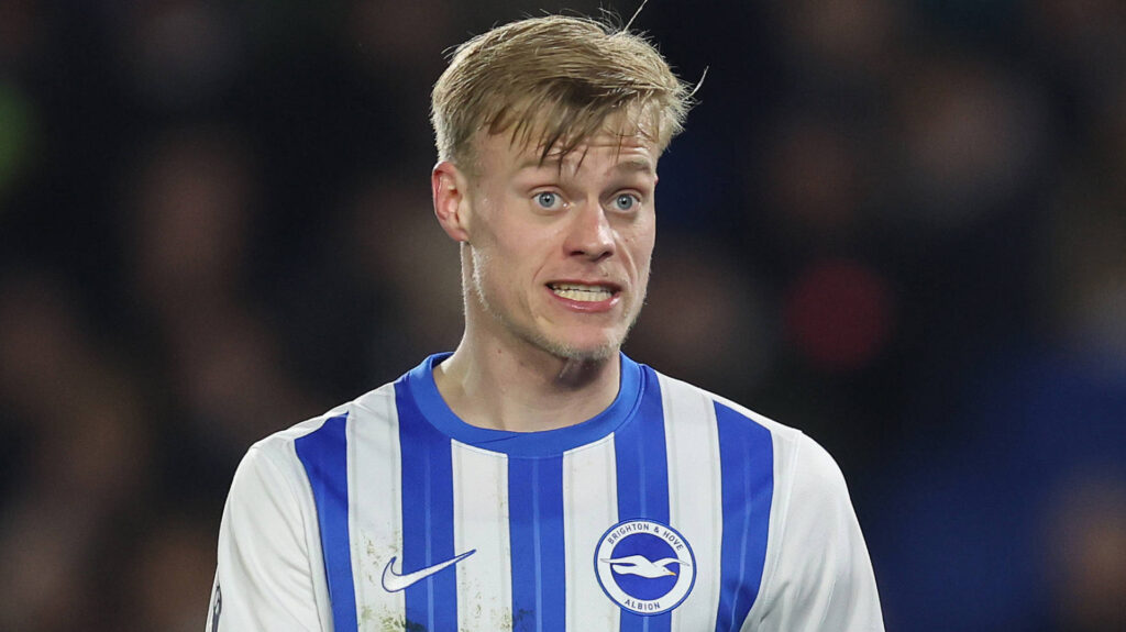 Jan Paul van Hecke looking concerned while wearing a Brighton shirt