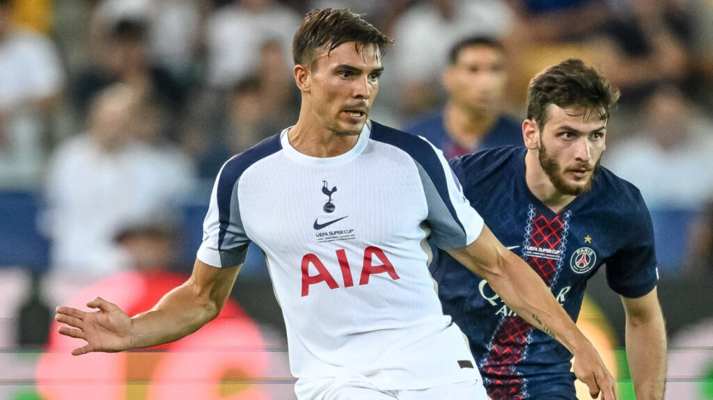 Joao Palhinha is closed down by PSG's Khvicha Kvaratskhelia.
