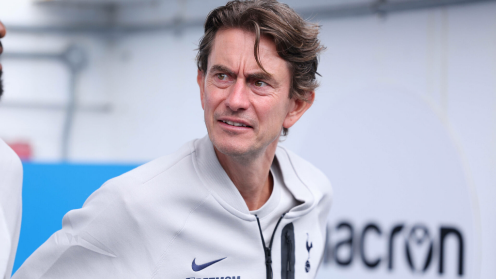 Tottenham manager Thomas Frank glances to the right with a bemused facial expression.