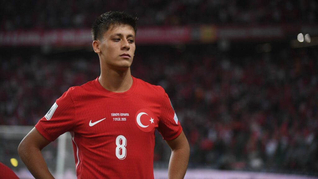 Tottenham target Arda Guler stands with his hands on his hips during a game for Turkey.