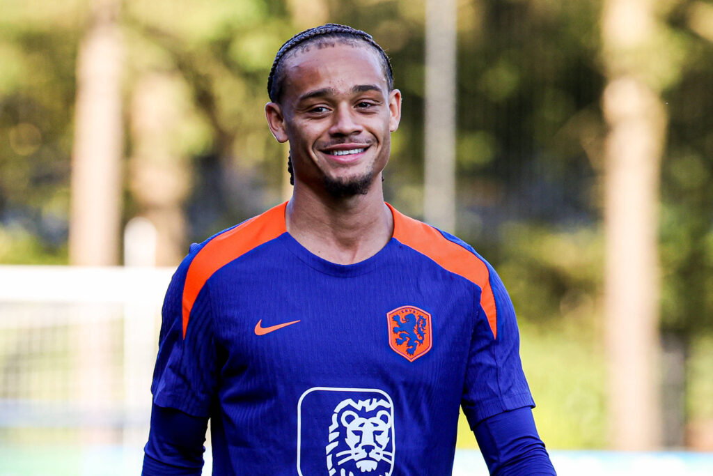 Xavi Simons smiling as he reports to the Netherlands for international duty
