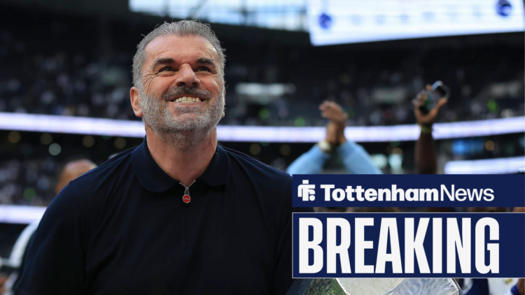 Ange Postecoglou smirks with the Europa League trophy in his hands