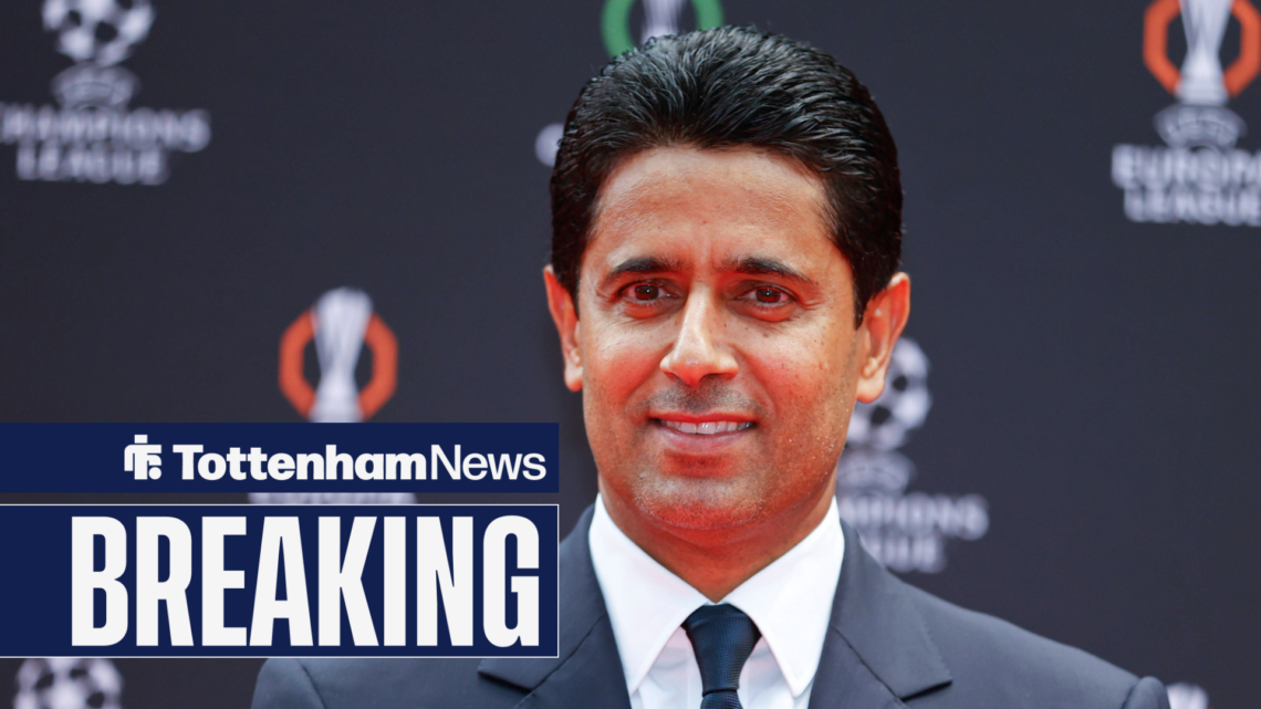 Nasser Al-Khelaifi smiles while wearing a suit.