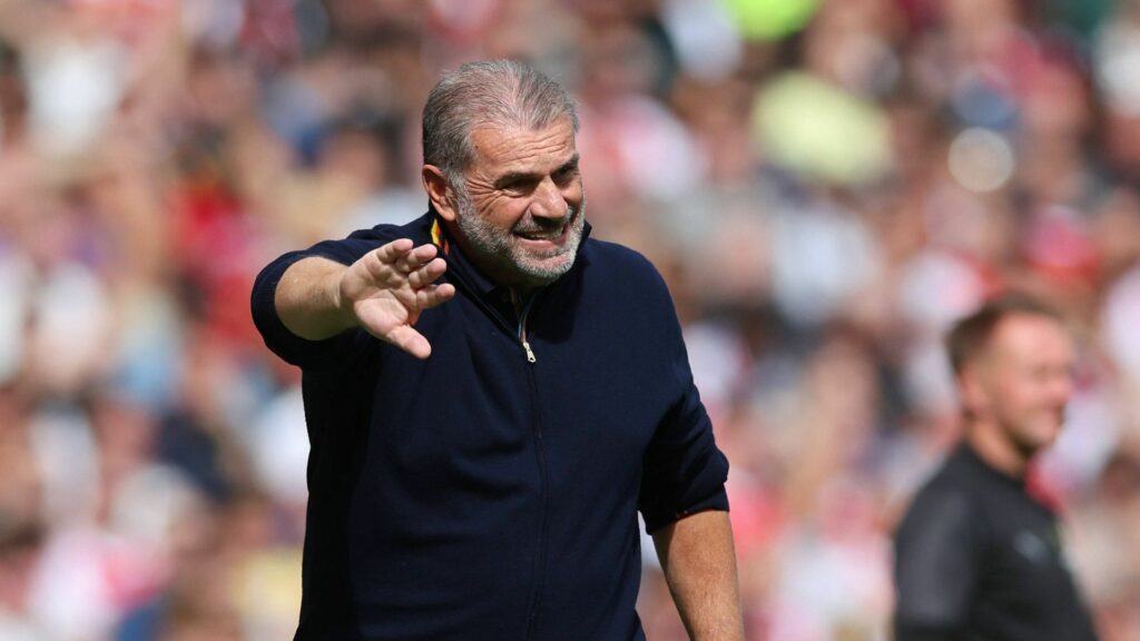 Ange Postecoglou pushes out his arm while managing Nottingham Forest.