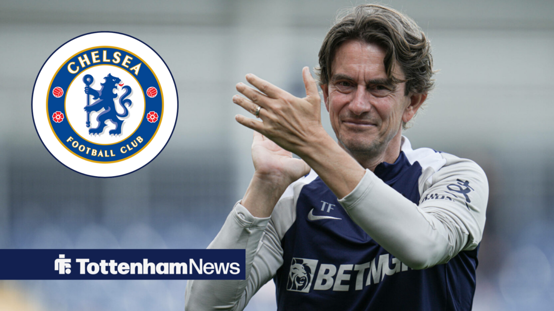 Tottenham manager Thomas Frank smiles and applauds in the direction of the Chelsea badge.