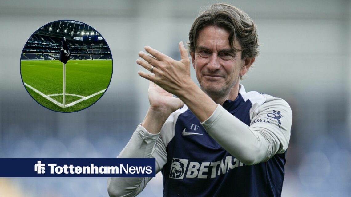 Tottenham manager Thomas Frank smiles and applauds towards a circular inset, which features a corner flag at the Tottenham Hotspur Stadium.