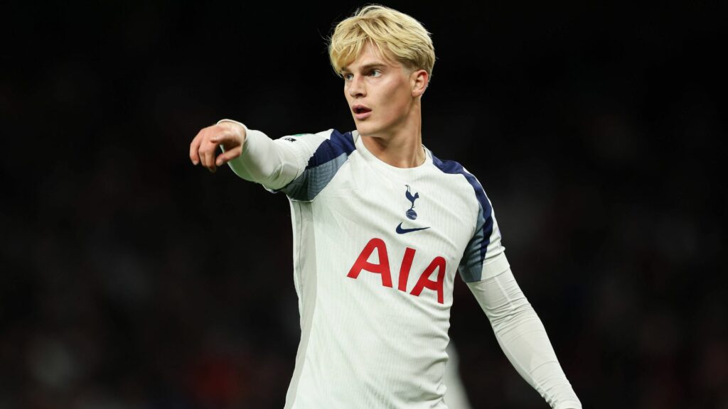 Lucas Bergvall points to the side during a game for Tottenham.