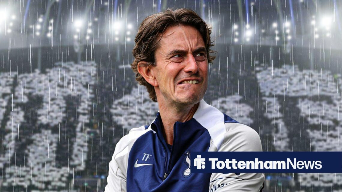 Thomas Frank looking subdued in rain at Tottenham Hotspur Stadium