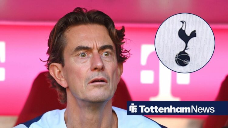 Thomas Frank looks stunned at the Tottenham badge.