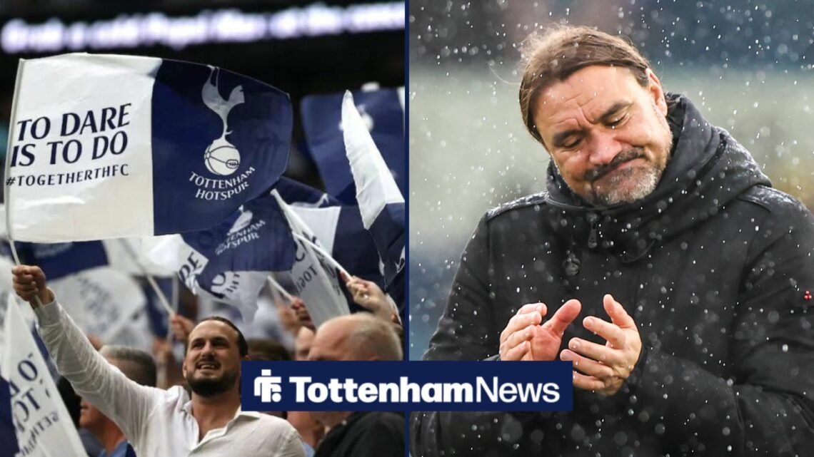 Leeds manager Daniel Farke claps in the rain. To the left of him are Tottenham fans waving flags.
