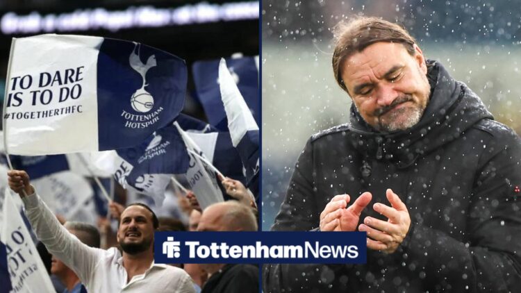 Leeds manager Daniel Farke claps in the rain. To the left of him are Tottenham fans waving flags.