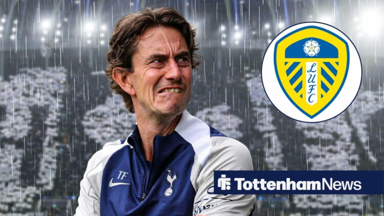 Spurs manager Thomas Frank stands in the rain at the Tottenham Hotspur Stadium, as he stares concernedly towards the Leeds United badge, which feat...