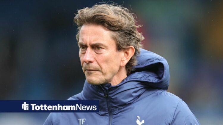 Thomas Frank frowns in a Tottenham coat