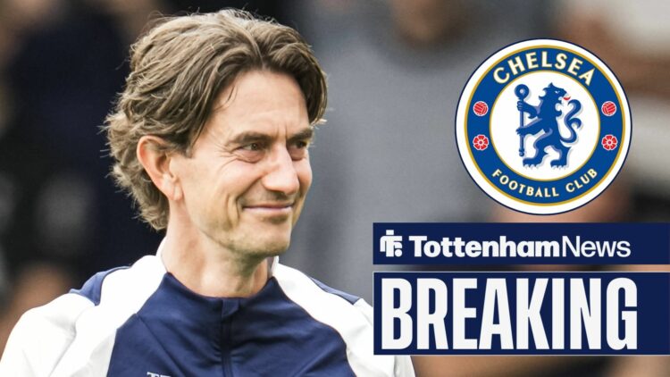 Thomas Frank smiling at Chelsea badge in circular inset