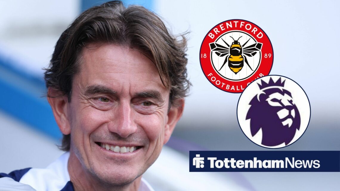 Thomas Frank looking at the Brentford and Premier League badge.