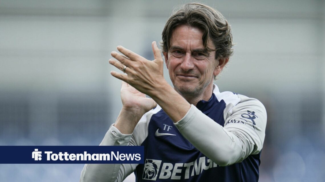 Thomas Frank clapping in Tottenham gear