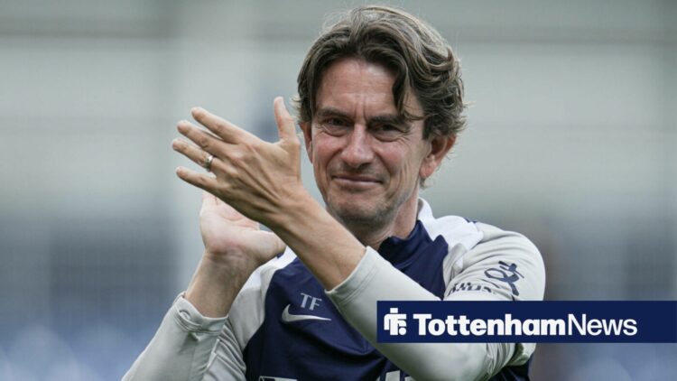 Thomas Frank clapping in a Tottenham tracksuit