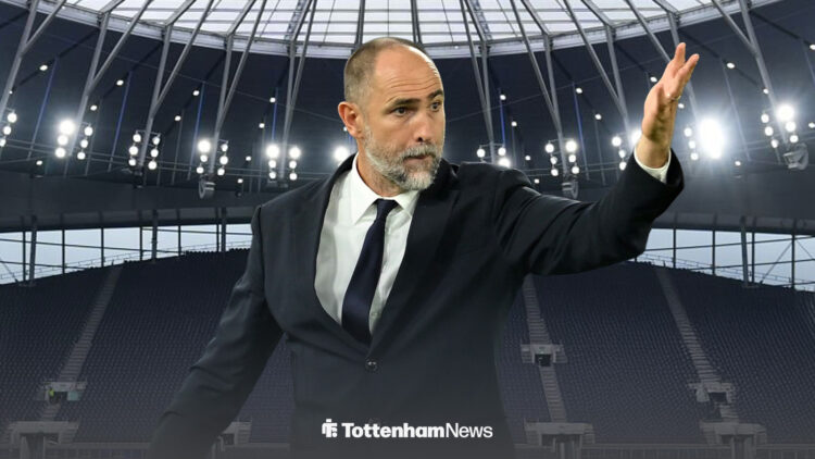 Igor Tudor waving his arm with the Tottenham Hotspur Stadium in the background