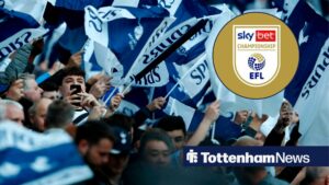 Tottenham fans wave their flags in the crowd before the UEFA Champions League semi-final first leg football match between Tottenham Hotspur and Ajax at the Tottenham Hotspur Stadium in north London, on April 30, 2019 with Championship logo in circular inset