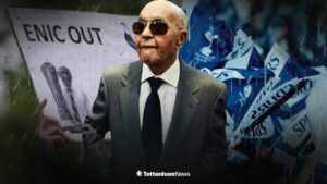 Joe Lewis looking towards a Tottenham fan holding an ENIC out sign