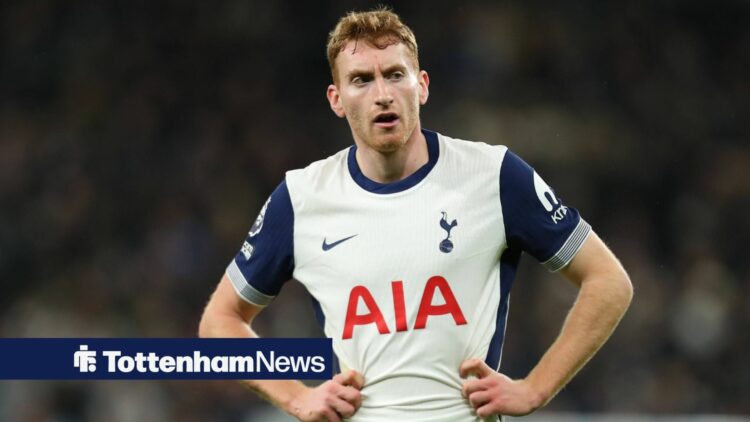 Tottenham star Dejan Kulusevski stands with his stands on his hips during a game.